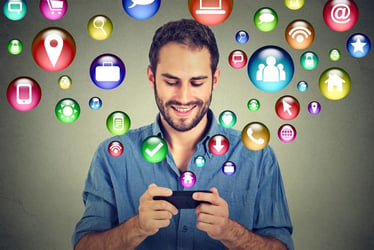 Church Social Media Strategy Blog - Man with Phone & Icon Bubbles